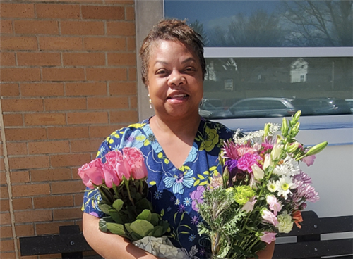  Trudy Small holding flowers
